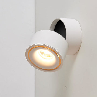 Modern white wall-mounted light fixture on a neutral background