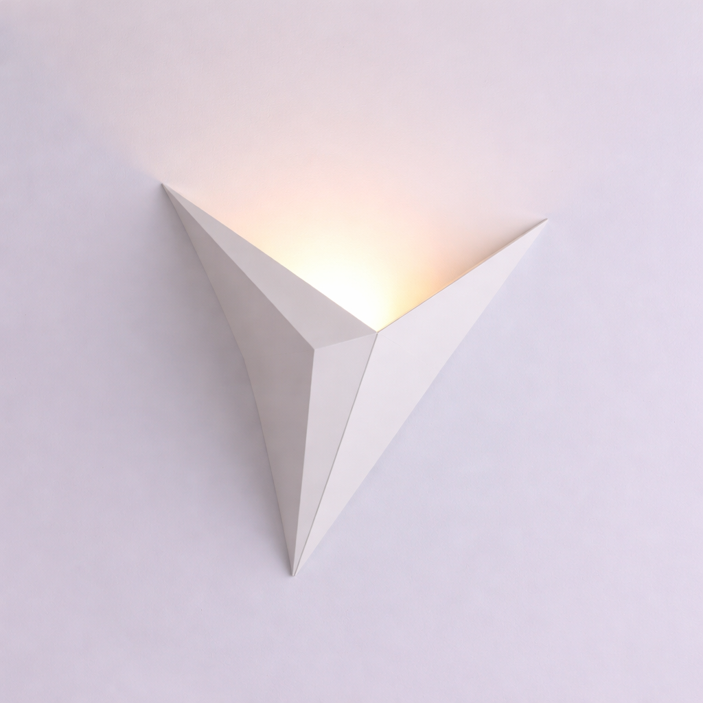 Triangular wall light fixture on a white background