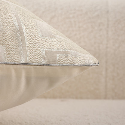 Textured beige pillow on a neutral background