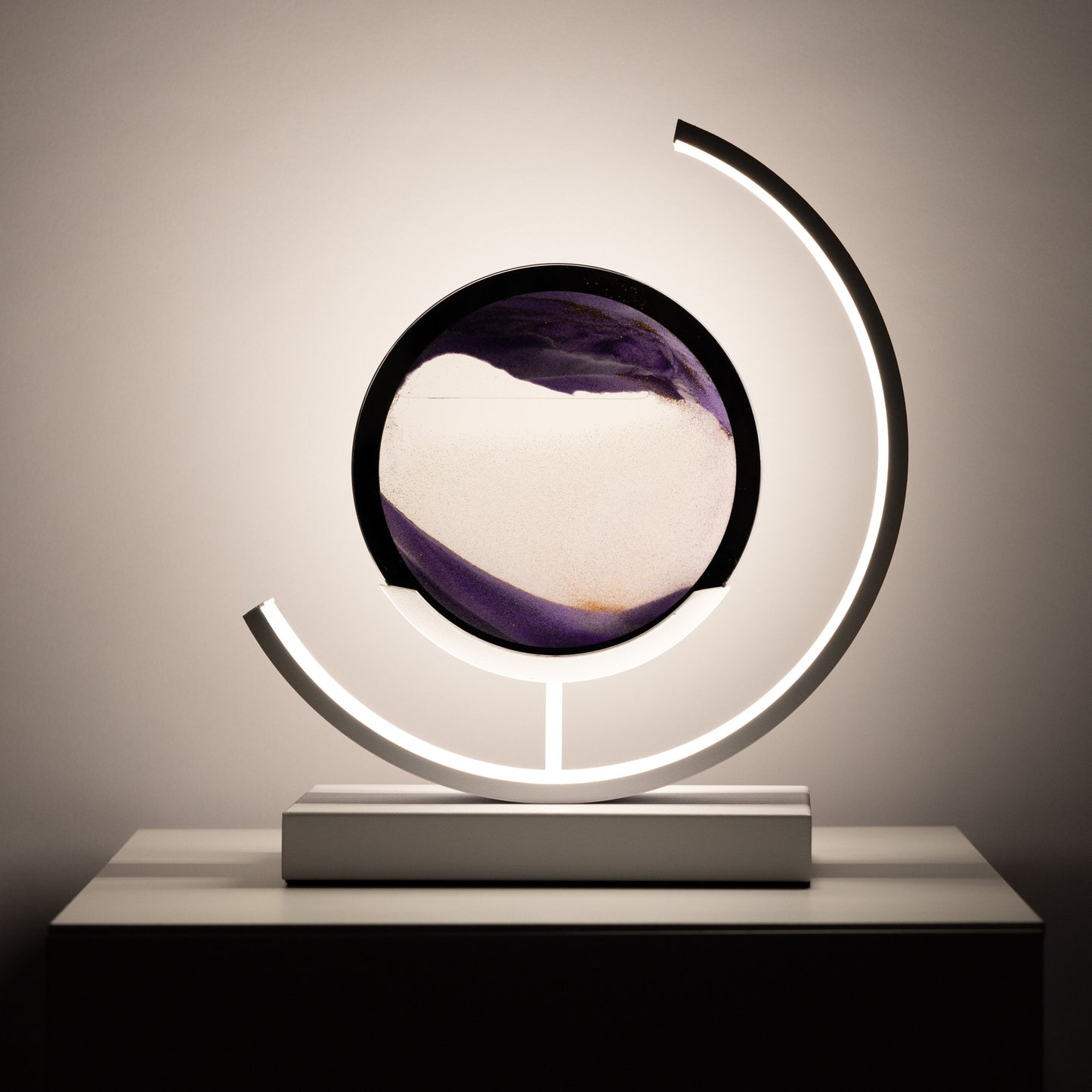 Decorative lamp with a circular design and light fixture on a neutral background