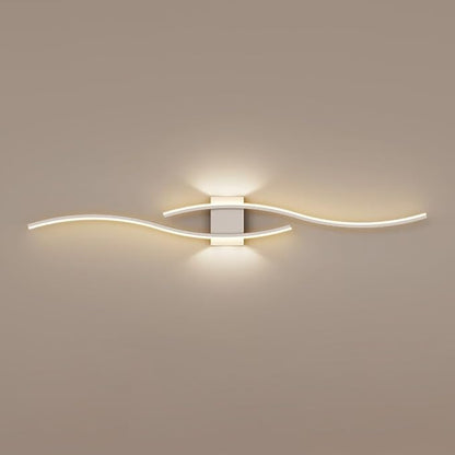 Modern wall light fixture on a beige wall