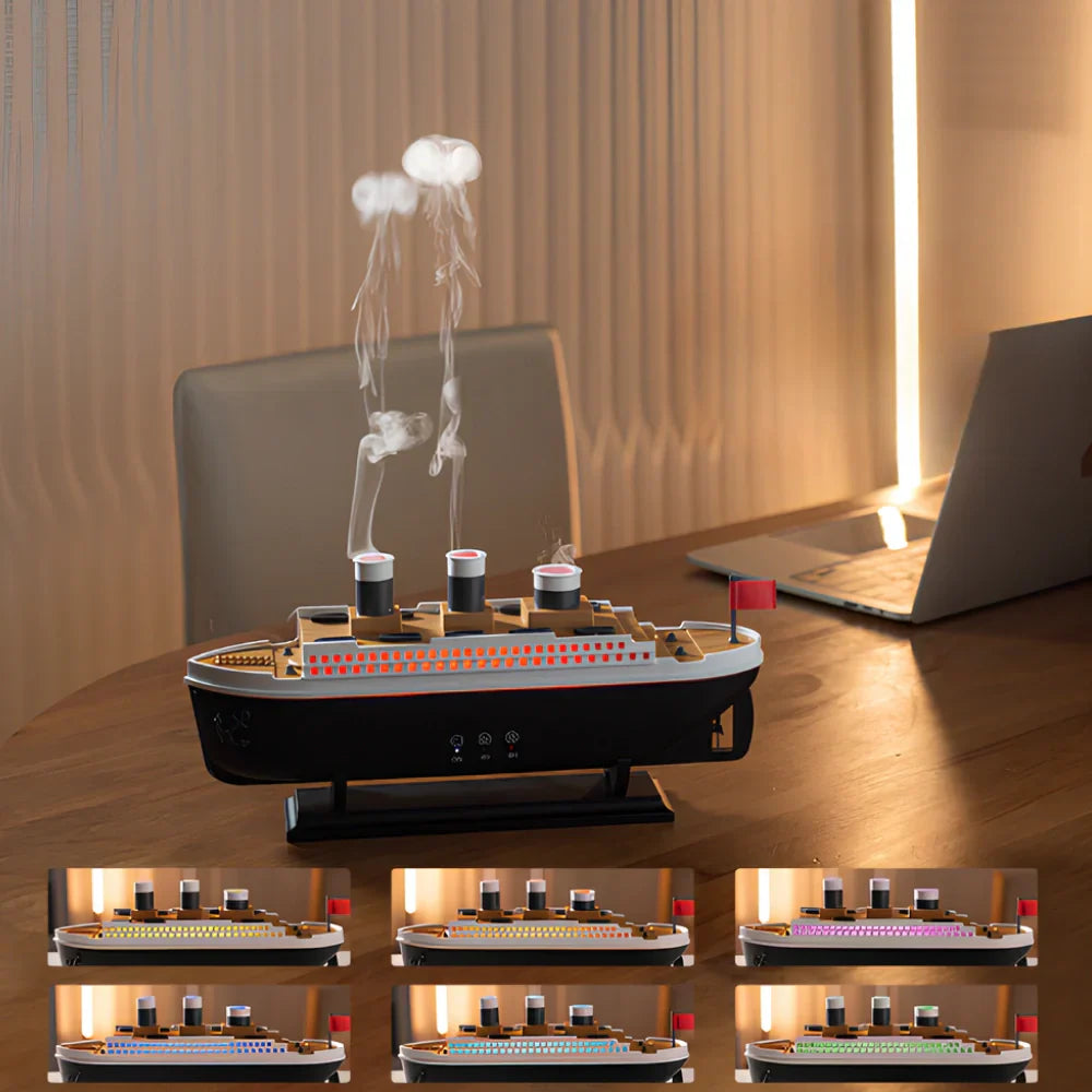Model ship with smokestacks on a desk next to a laptop