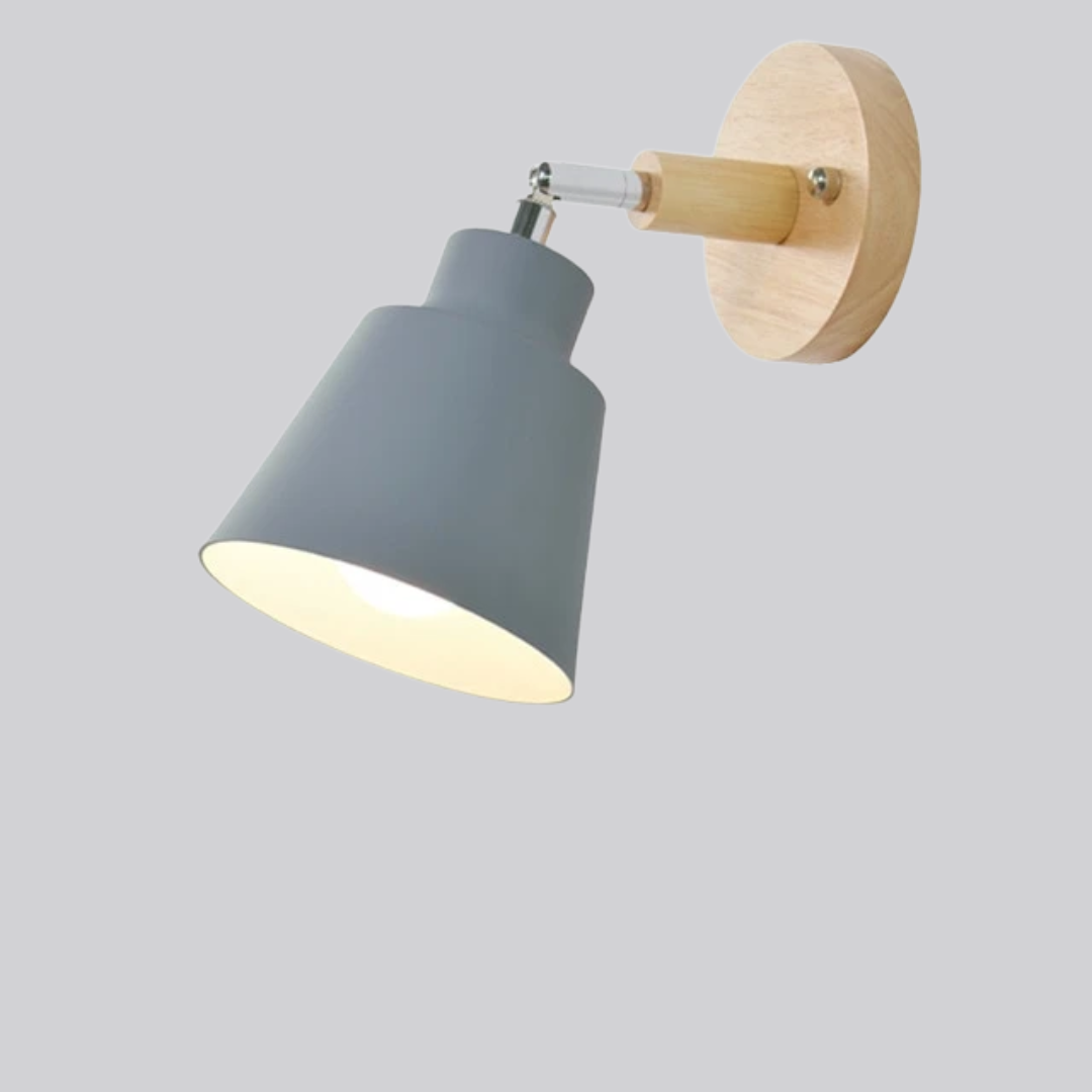 Wall-mounted lamp with gray shade and wooden base on a light gray background