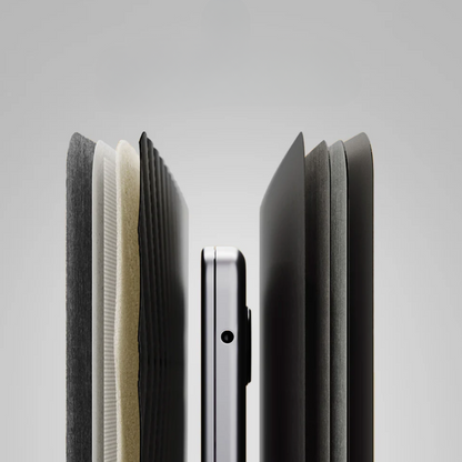 Close-up of a smartphone with a black case on a light gray background
