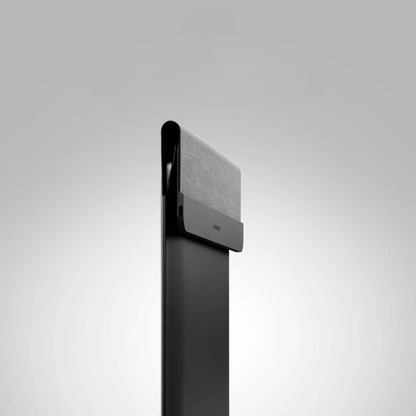 Black electronic device with a textured panel on a gray background