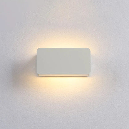Rectangular wall light fixture on a white wall