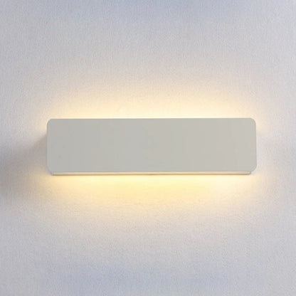 Rectangular wall light fixture on a plain wall