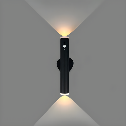 Black wall-mounted light fixture on a gray background