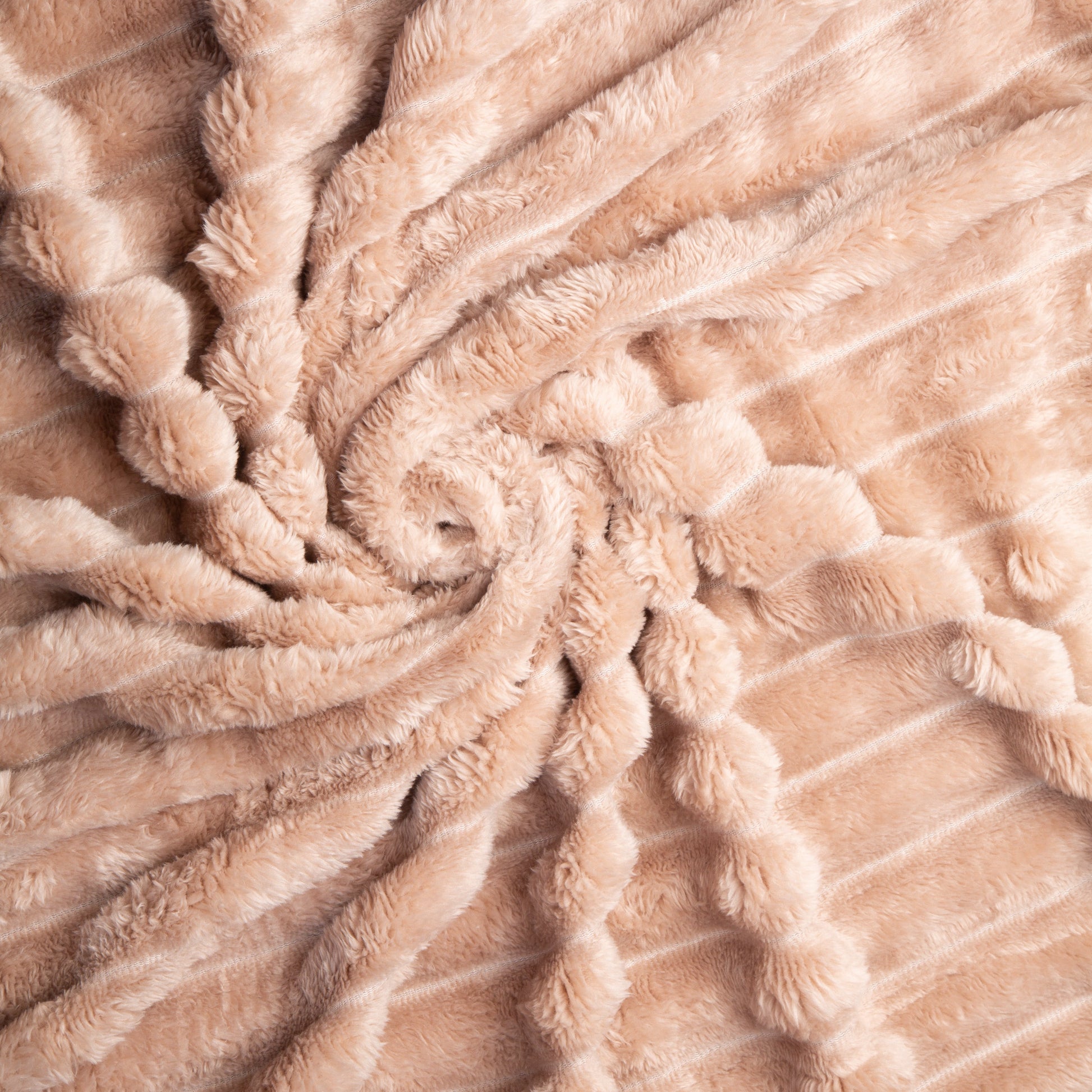 Close-up of beige textured fabric with a spiral pattern