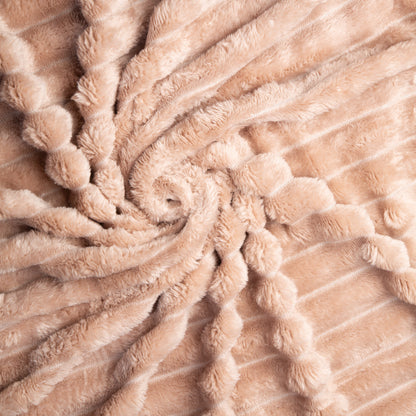 Close-up of beige textured fabric with a spiral pattern