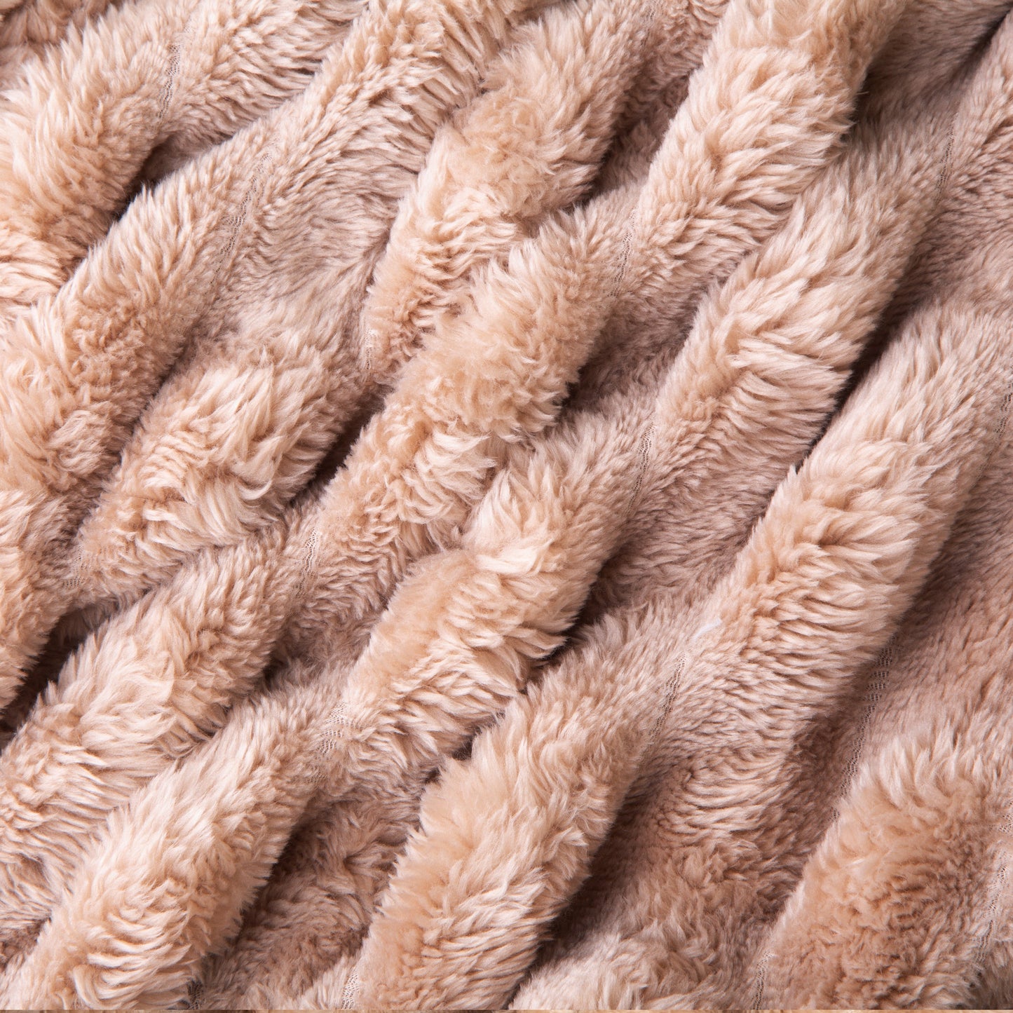 Close-up of a beige, textured blanket