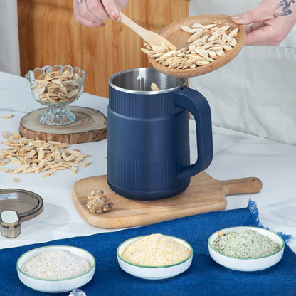Person adding ingredients to a blue mug on a kitchen counter with various bowls of ingredients.