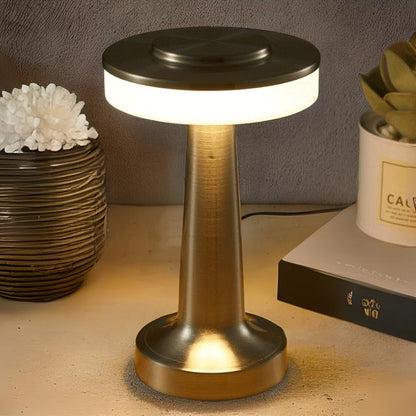 Table lamp on a surface with decorative items in the background