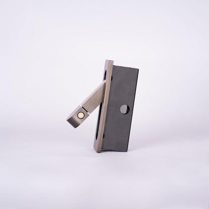 Metallic folding knife on a white background
