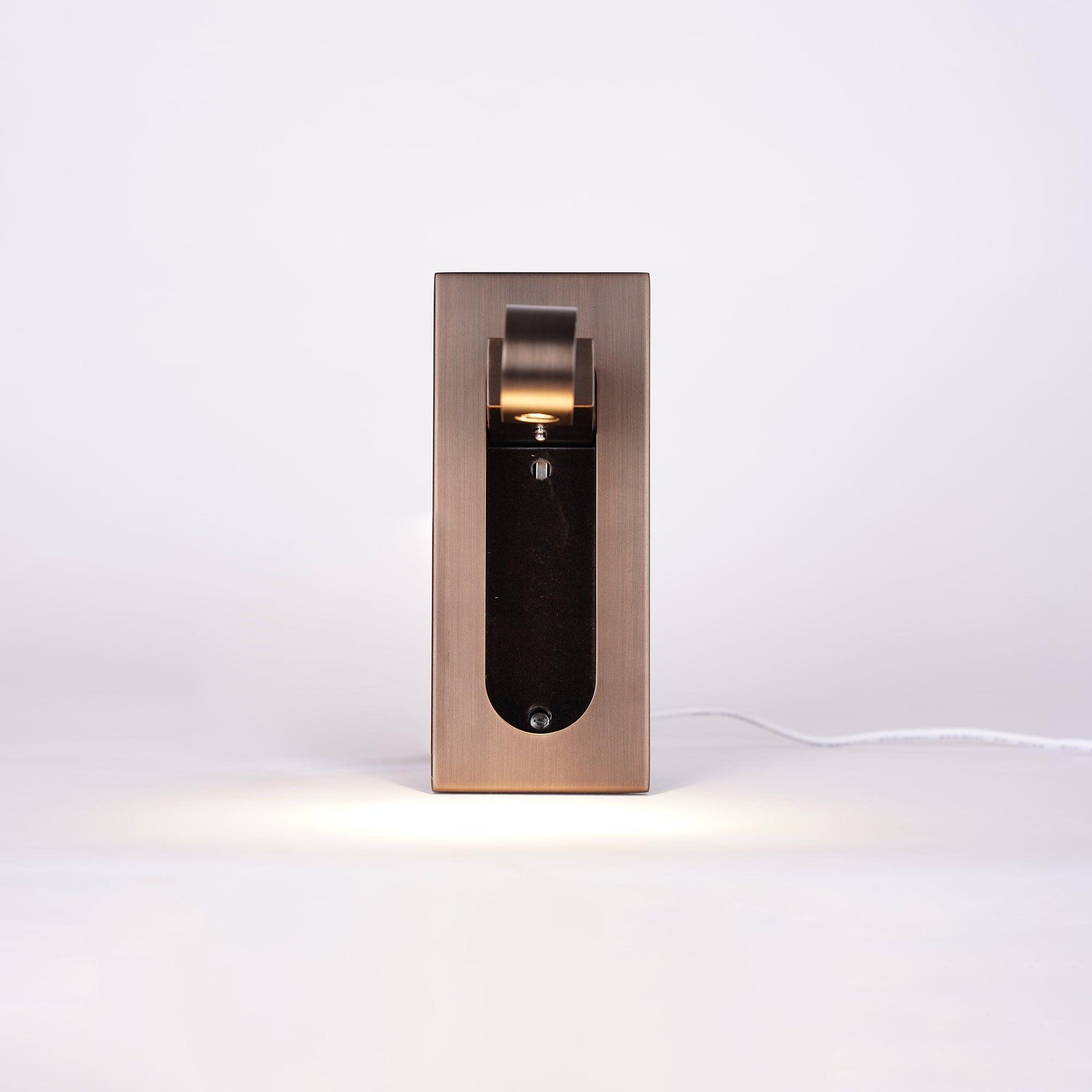 Modern wall-mounted light fixture on a white background