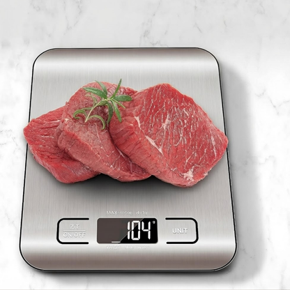 Raw meat on a digital kitchen scale with a white marble background