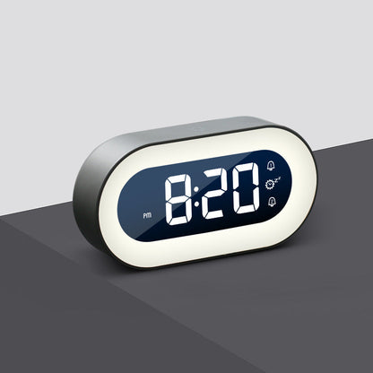 Digital clock with LED display on a gray surface