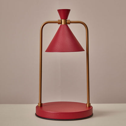 Red and gold table lamp on a beige background