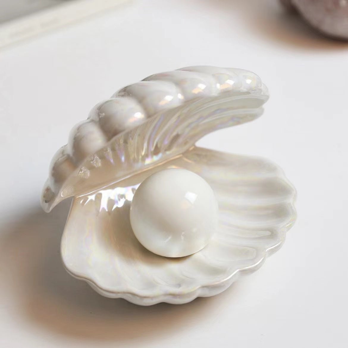 Pearl inside an open shell on a white background