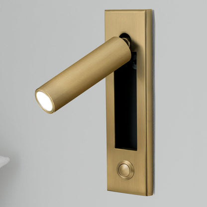 Brass door handle with integrated light on a gray background