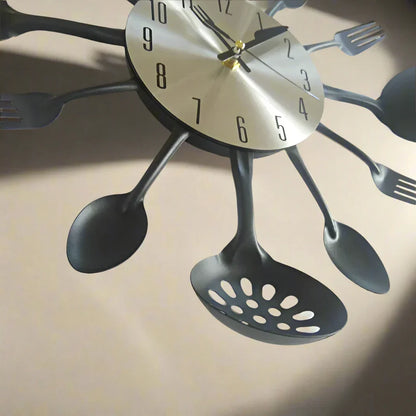 Wall clock with spoon, fork, and ladle design on a beige background