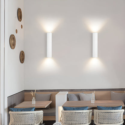 Modern restaurant interior with tables, chairs, and wall decor.