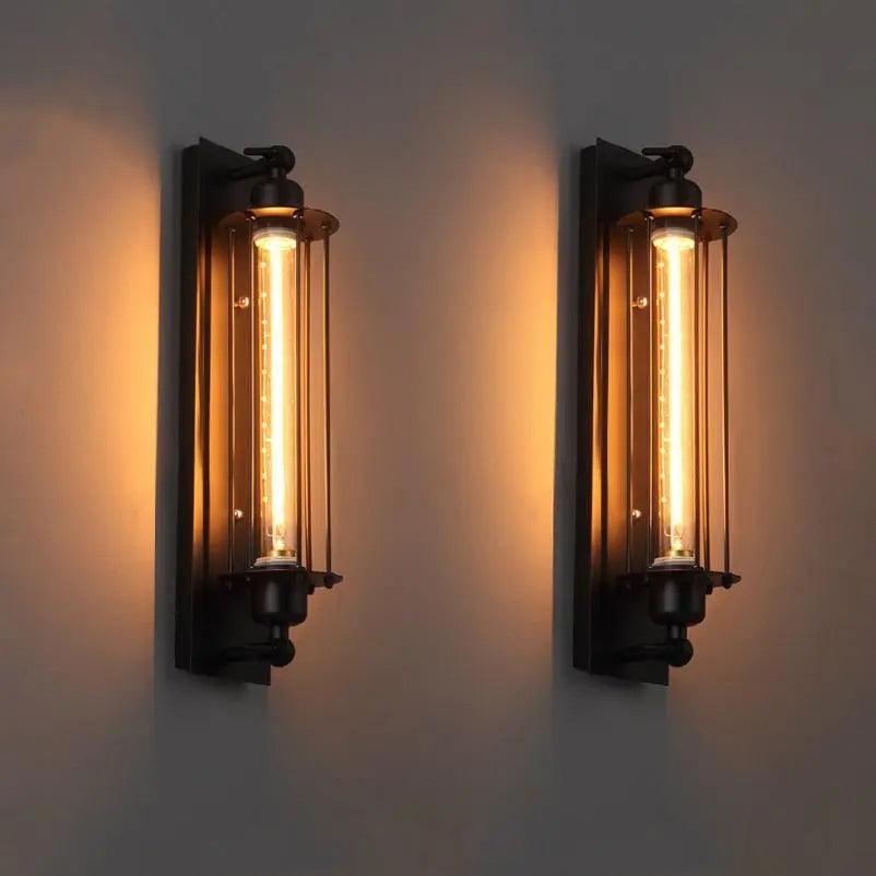 Two wall-mounted lights with glowing bulbs on a plain background