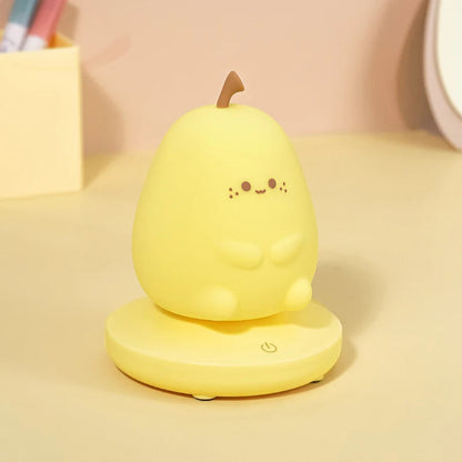 Yellow pear-shaped night light with a smiling face on a beige background