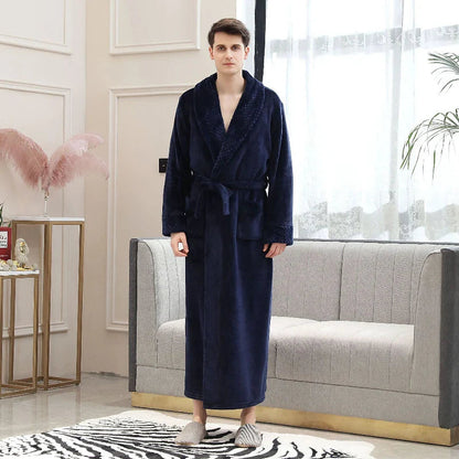 Person wearing a navy blue robe in a modern living room.