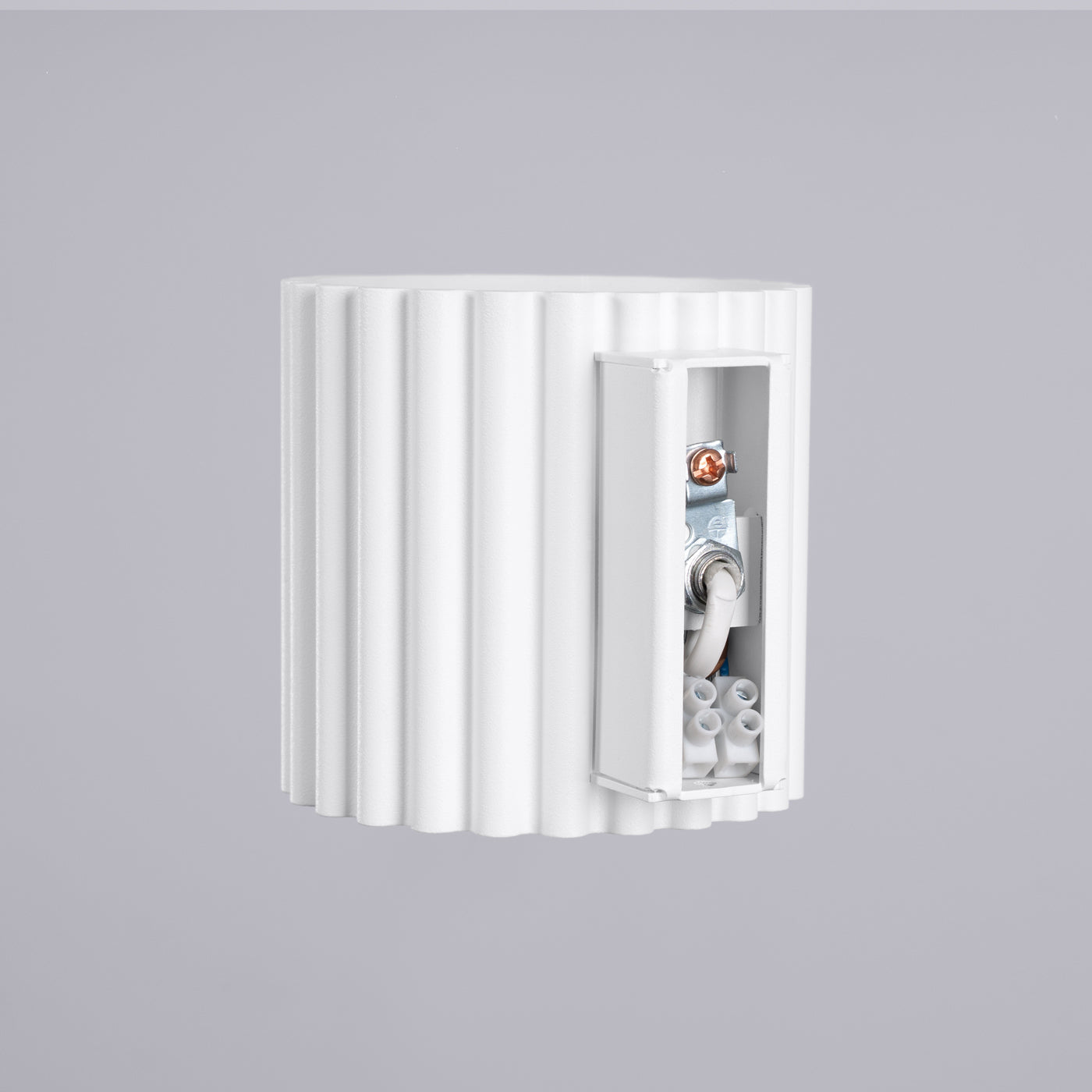 White wall-mounted electrical box with a gray background