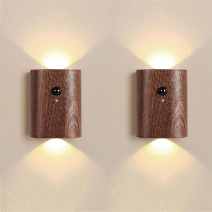 Two wooden wall lights on a beige wall