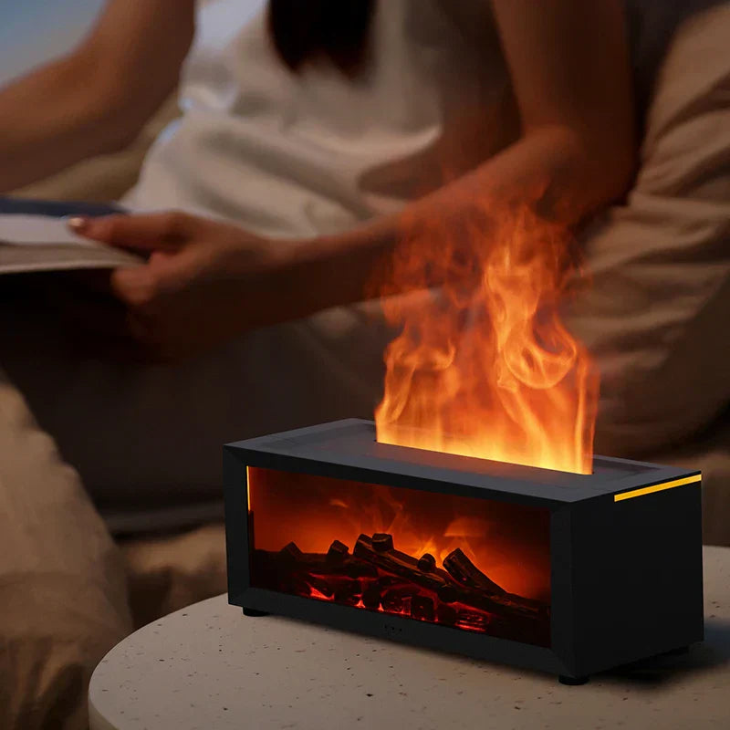 Tabletop fire pit with flames on a table, person reading a book in the background