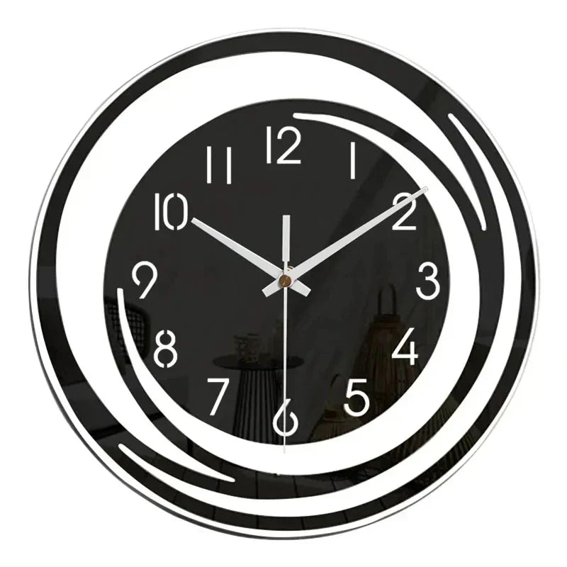 Black wall clock with white numbers and hands on a white background