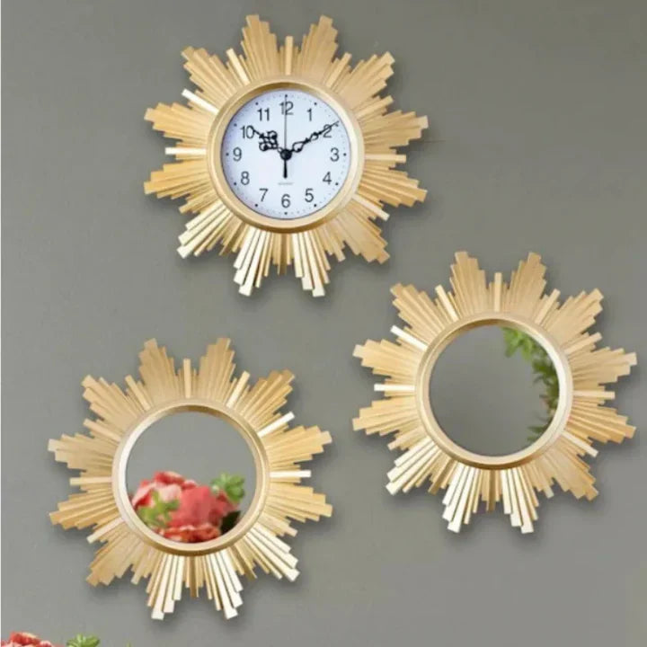 Three decorative wall clocks with sunburst designs on a gray background