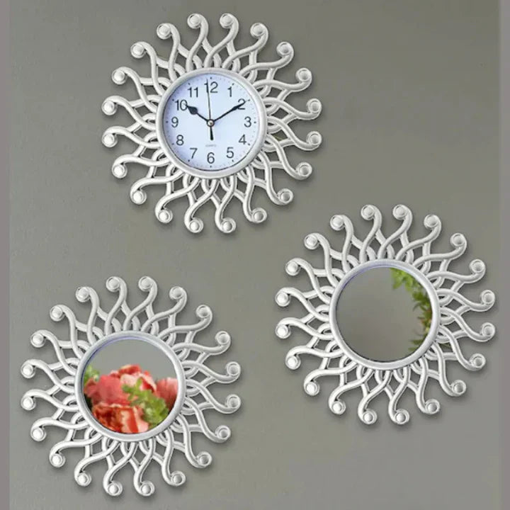 Decorative wall clock and mirrors with sunflower design on a gray background