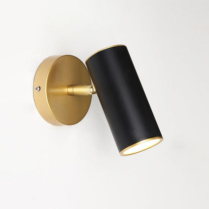 Wall-mounted light fixture with black cylindrical shade and gold adjustable arm on a white background