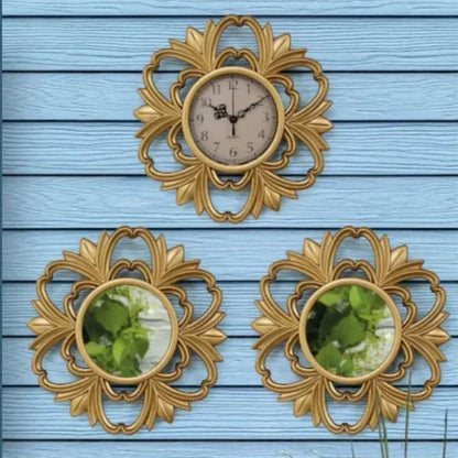 Three decorative gold wall clocks on a blue wooden background