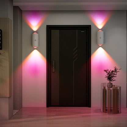 Modern interior design with a black door, wall lights, and decorative elements.