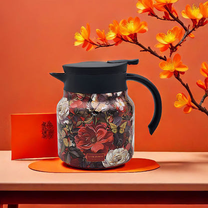 Floral-patterned jar with black lid and handle on an orange background