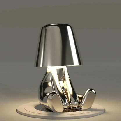 Chrome-finished lamp with a unique design on a neutral background