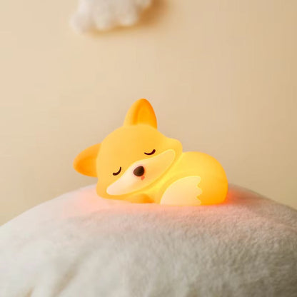 Corgi-shaped night light on a soft surface with a beige background